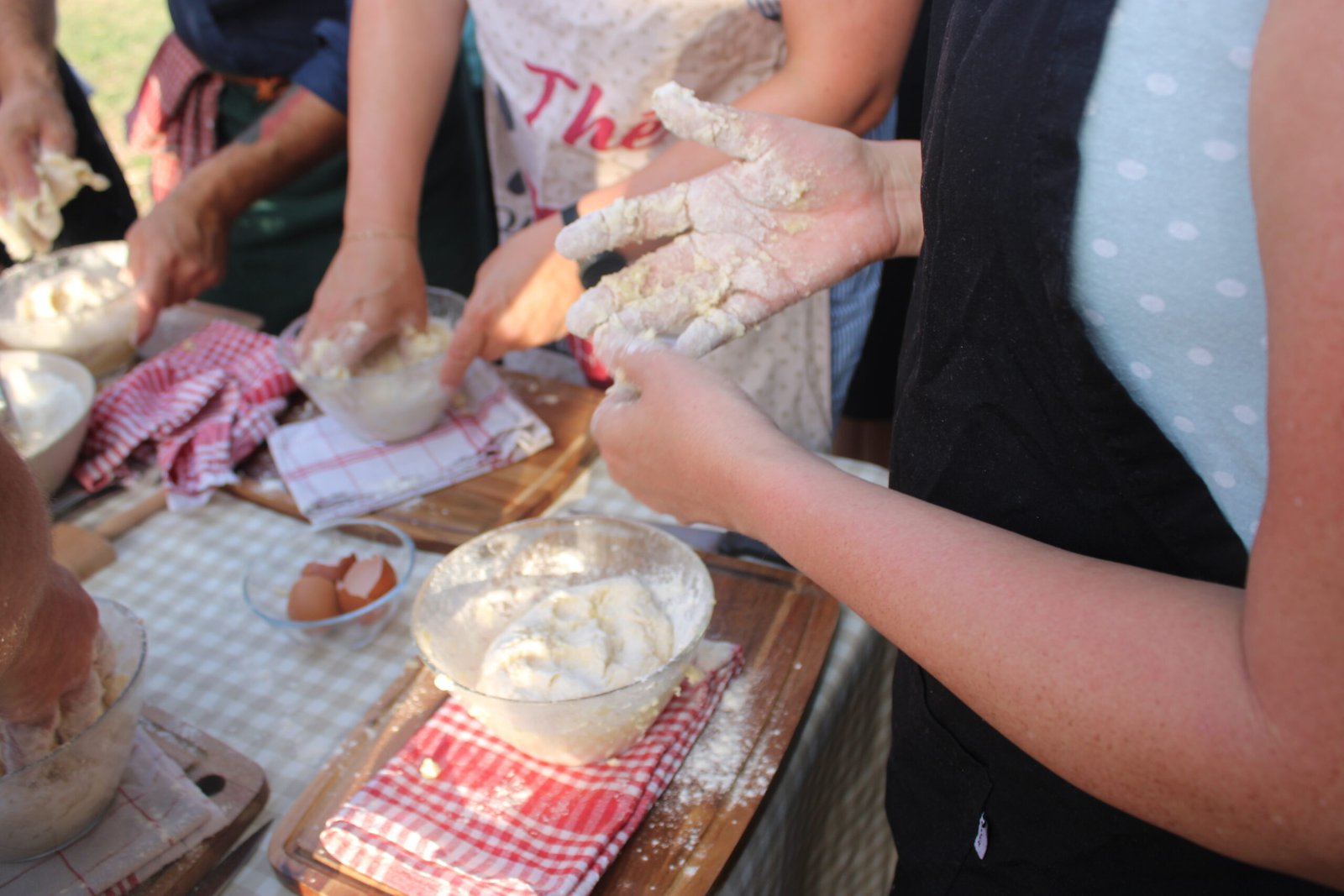 Guests preparing handmade gnocchi together